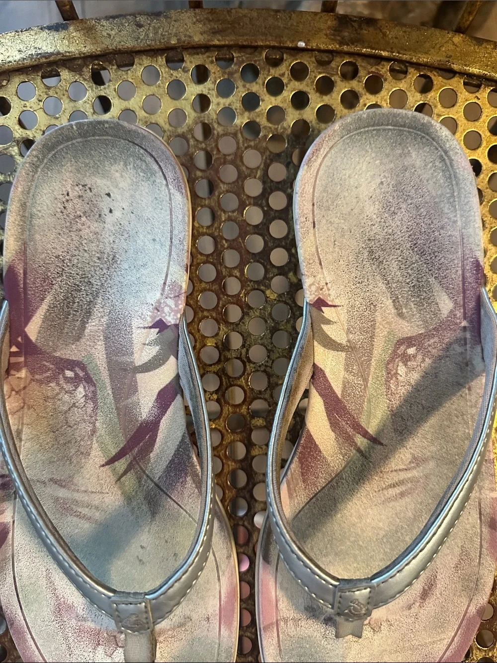 OluKai Metallic Silver Flip Flops with Purple Floral Accent